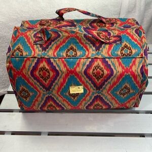 JM New York Aztec print multicolor cosmetic roll up bag.